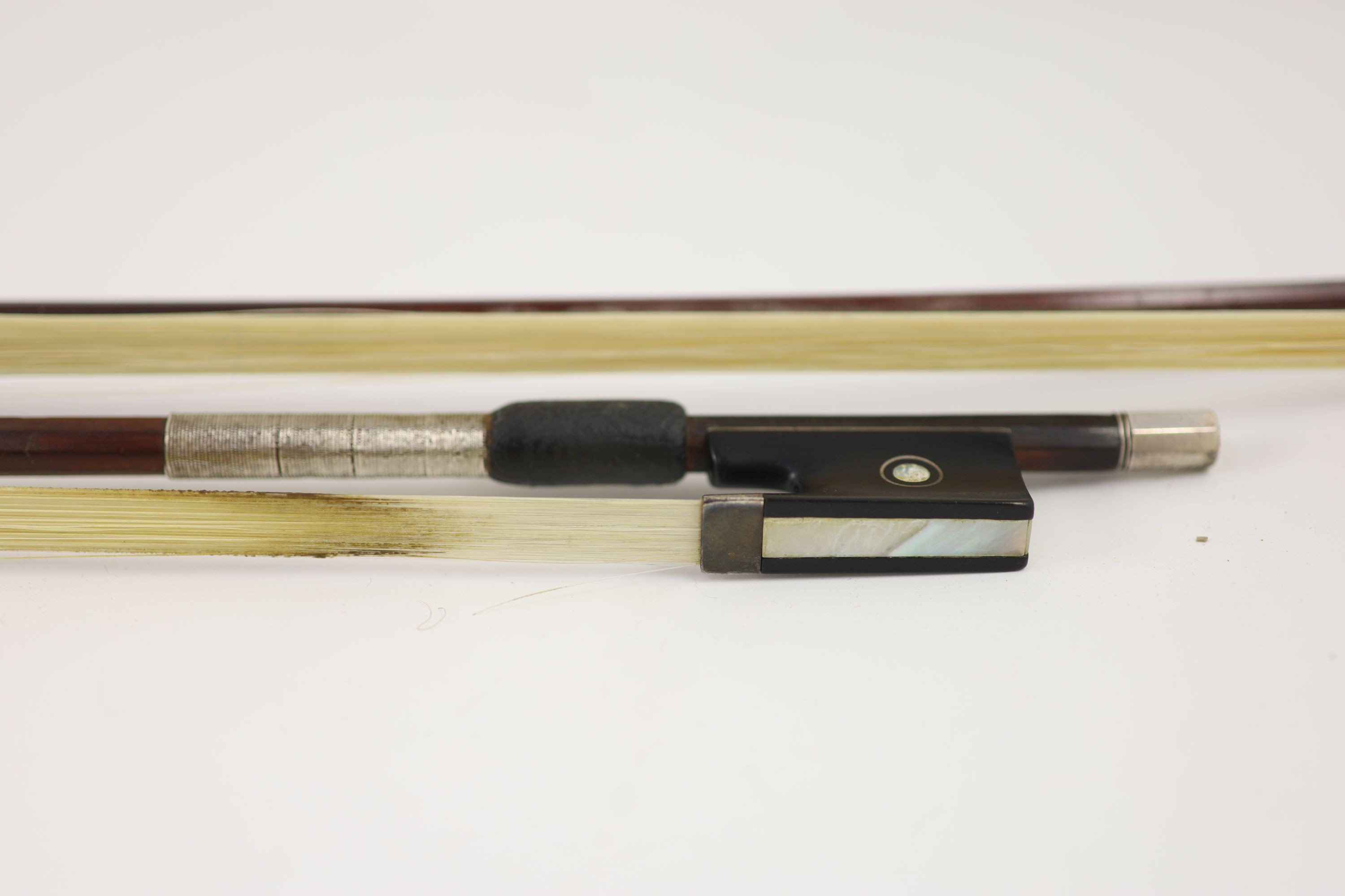 Two stamped violin bows, Both 74.5 cm long